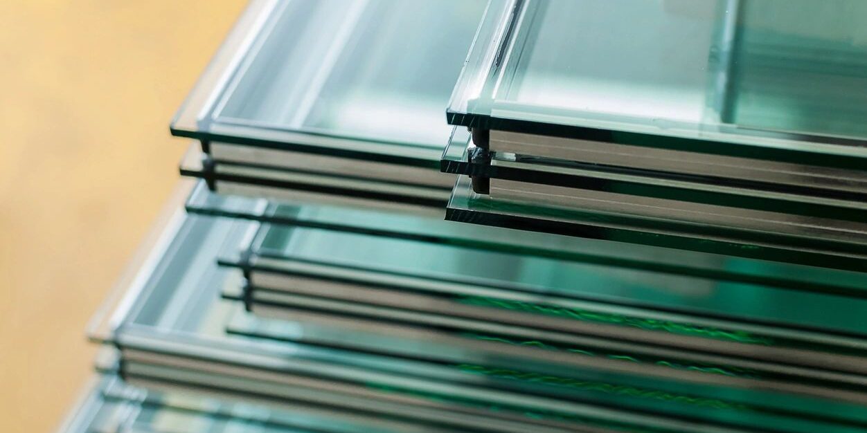 Stacked glass panes with green edges